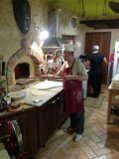 My gourmet-Hairdresser at work at his Pizza oven